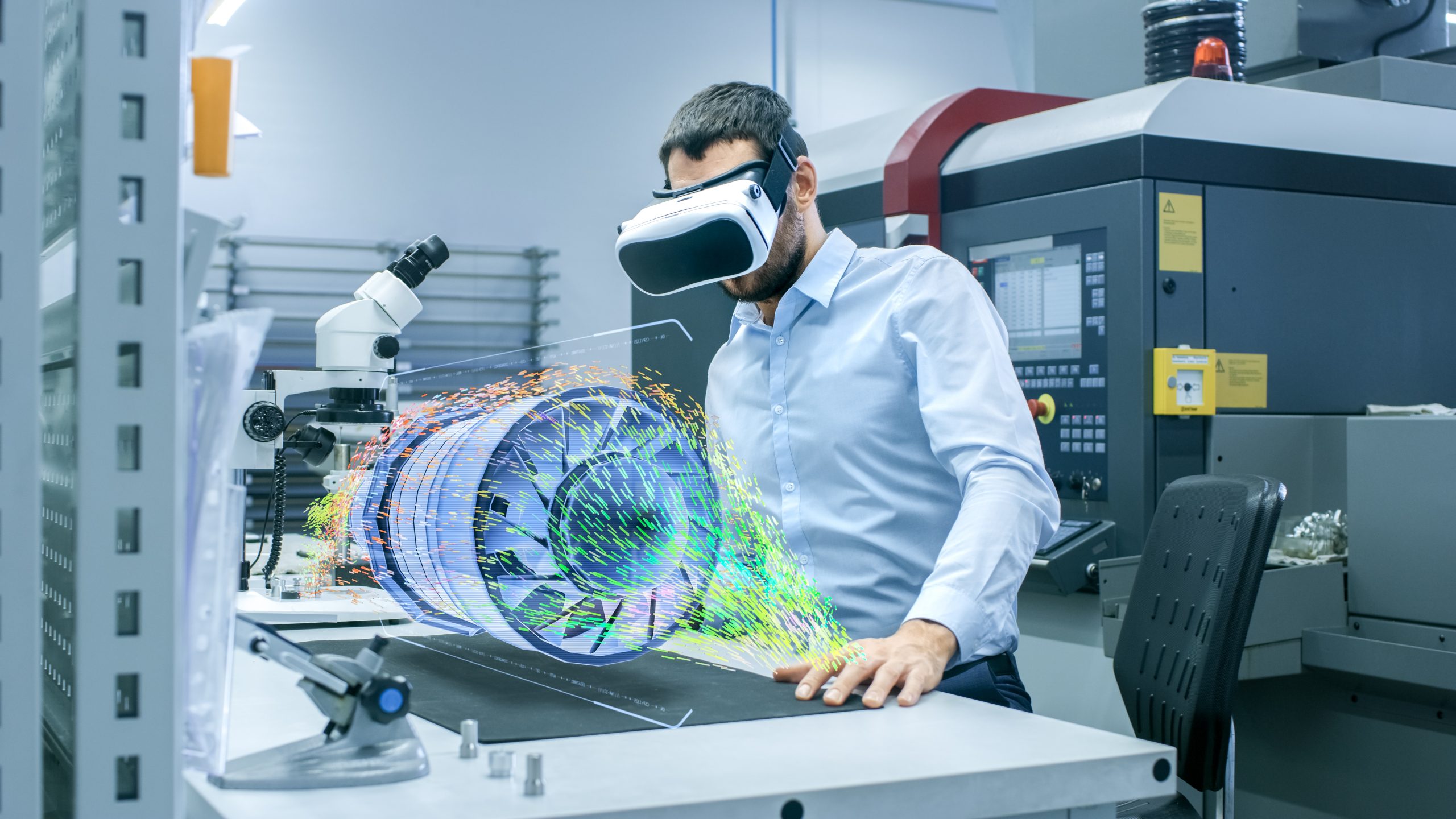 Factory Chief Engineer Wearing VR Headset designs engine turbine on the Holographic Projection table. Futuristic design of virtual mixed reality application.
